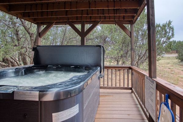 The private hot tub on the back deck is the perfect spot to relax and unwind.