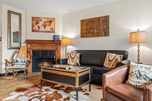 Smoky Mountain charm meets ultimate comfort! This inviting living room is designed with the beauty of the Smokies in mind. Sink into our plush sofa—perfect for relaxing after a day of adventure. Need extra space? It effortlessly transforms into a cozy sof