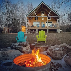 Front yard fire pit with seating for chilly nights.