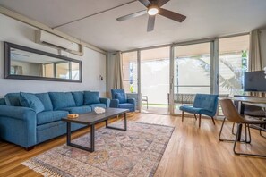 Living features split AC system, sofa sleeper, Smart TV with cable, and plenty of seating