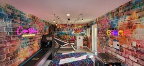 Enjoy sone competitive fun in yet another game room with skee-ball, an arcade, and basketball