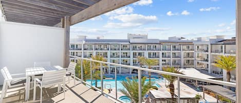 The Pointe 344 | walkout balcony | Overlooking the resort-style pool, poolside cabanas and picnic green