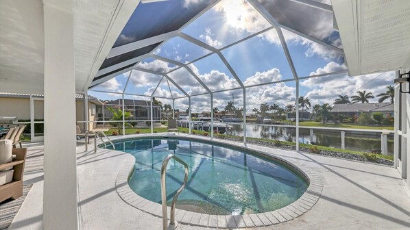 Lanai with pool overlooking the canal