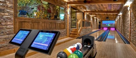Enjoy private bowling lanes with laser lights and a 3000 gallon fish tank