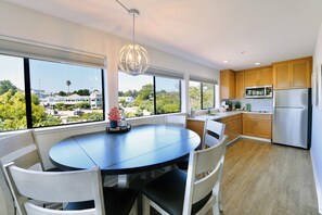 Elegant and open full kitchen & dining area.