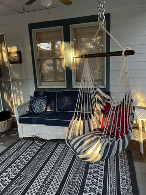 Outdoor swing and sofa are perfect for early morning coffee or nighttime chats