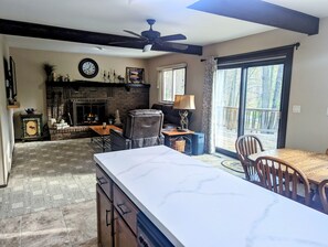 Upper level features an open concept living area, kitchen and dining area.