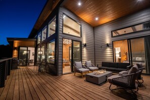 One of the two outdoor lounging areas with gas fire pits. This space provides a seamless indoor/outdoor flow with the main floor.