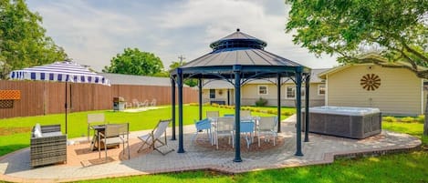 Huge backyard entertainment paradise! There are lights under the gazebo and around the pathways & a few flood lights in the back yard. WIFI reaches to the gazebo outdoor workspace, desk, outdoor office space. 