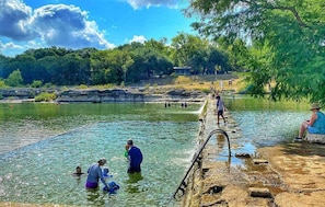 Natural swimming pool at Blanco River State Park, 2 min drive from our property.