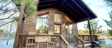 The Talking Rain cabin has a spacious front porch perfect for coffee drinking.