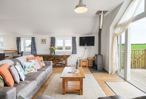 Hayloft at Trevissick Farm, Porthtowan. Relax on the large sofas and watch some television