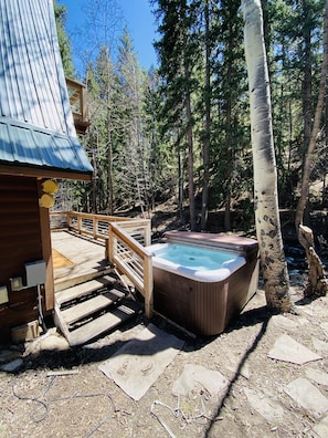 Back deck with out new hot tub, next to the tranquil Clear Creek!