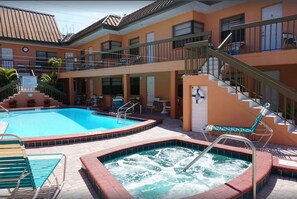 Private heated pool and hot tub. This unit is the lower level room in the center