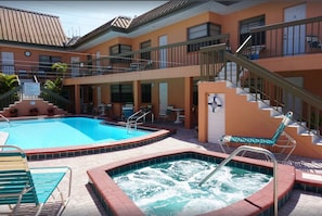 Private heated pool and hot tub. This unit is the lower level room in the center