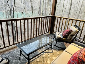 Back patio is overlooking the river. 