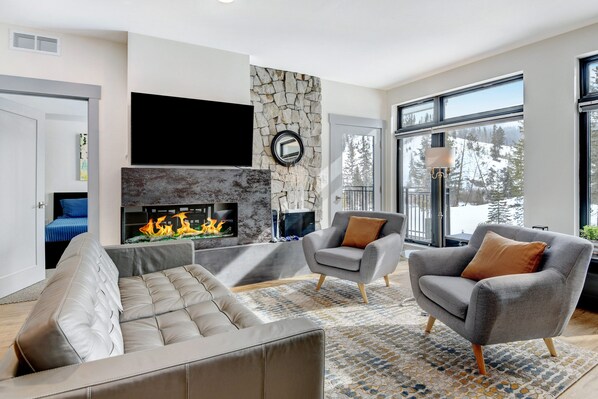 Step Inside This Gorgeous Second Floor Unit With Floor To Ceiling Windows & Cozy Furnishings