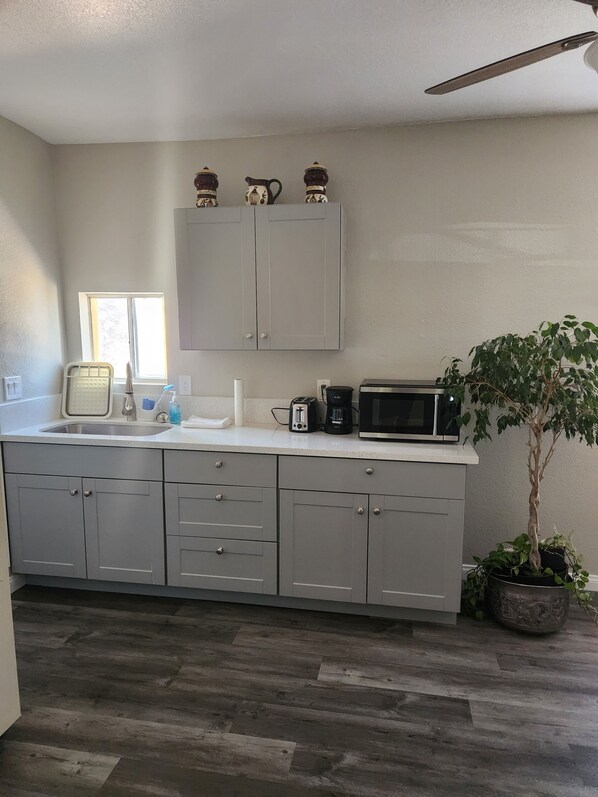 Kitchenette with microwave, toaster, coffee maker, etc.