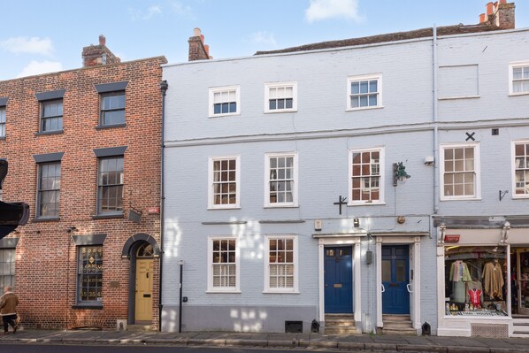 The Georgian House, Burgate sits opposite the Postern Gate