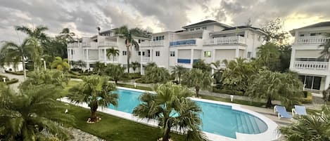 Pool view from upper balcony.  Condo is pool front.  