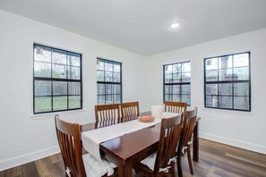 This spacious dining area provides a cozy spot to enjoy your culinary creations. With comfortable seating and a charming view of the surrounding area, you'll never want to leave!