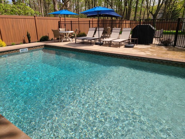 Brand new heated pool and patio area, fully fenced in