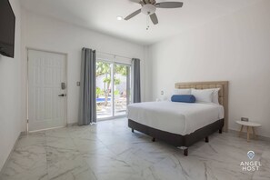 Large sliding glass doors give direct access to the pool area