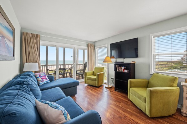 The ocean front living room is well-appointed with comfortable furnishings.