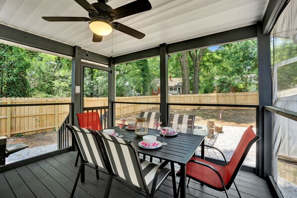 Screened in patio in fenced backyard
