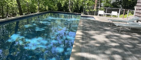 Heated pool.  Richard Schultz designed chaise lounge chairs.