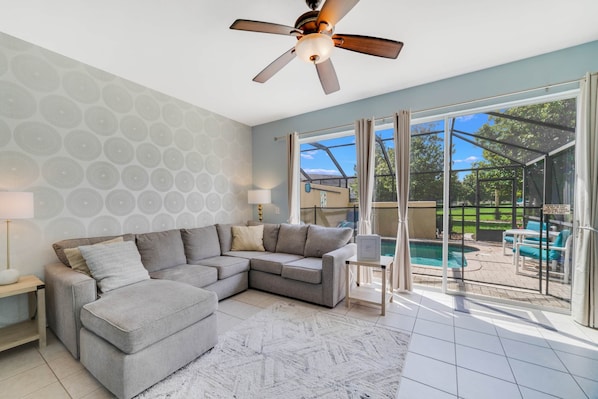 Living room opens to the pool