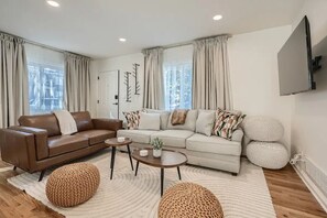 Queen-size pullout mattress in beige couch