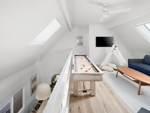 This cozy lounge area features a smart TV, games, and a tepee for the little ones, making it perfect for family fun and relaxation.