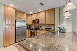 Fully Equipped Kitchen with Stainless Steel Appliances and Stunning Granite Countertops