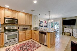 Luxury Fully Equipped Kitchen with Stainless Steel Appliances and Stunning Granite Countertops