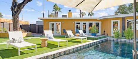 Beautiful sparkling pool and resort style backyard welcome you to