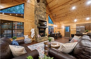 The living room is a large open space that includes kitchen and dining room.