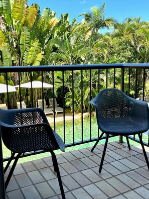 Open the lounge sliders allowing the outside in, giving you pool and beach views