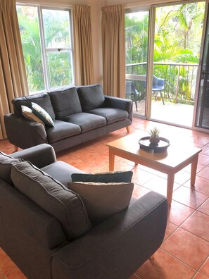 Lounge with comfy sofas and your own balcony to soak in the fabulous view