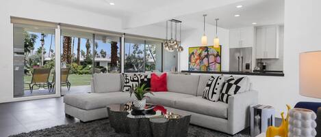 Some details in the family room: lovely overhead lighting and modern decor strike a balance between modernism and Hollywood glam.