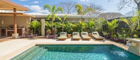Beautiful pool surrounded by a tropical garden