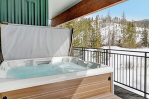 Private hot tub with mountain views.