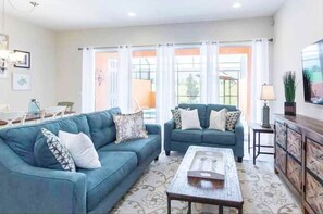 Relax in style in this spacious and elegantly decorated living room.

