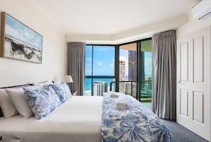 master bedroom with ocean views & balcony access 