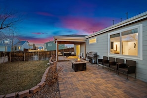 You will love the large back yard with a grill a propane fire pit.
