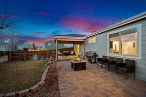 You will love the large back yard with a grill a propane fire pit.