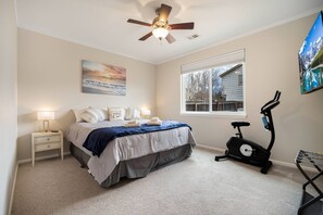 The large Mater bedroom comes with a wide screen and a bike machine.
