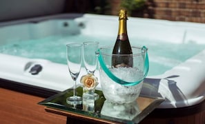 The hot tub is just a step out of the Summer room, private use for The Lodge