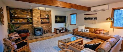 The living room is incredibly spacious and has plenty of entertainment for the whole group including board games for all ages and a 65" Roku smart tv and two comfortable leather Article couches.