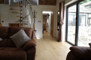 Lounge with dining area at Warren Barn, Newlands Farm near Kirkby Malzeard in Nidderdale AONB